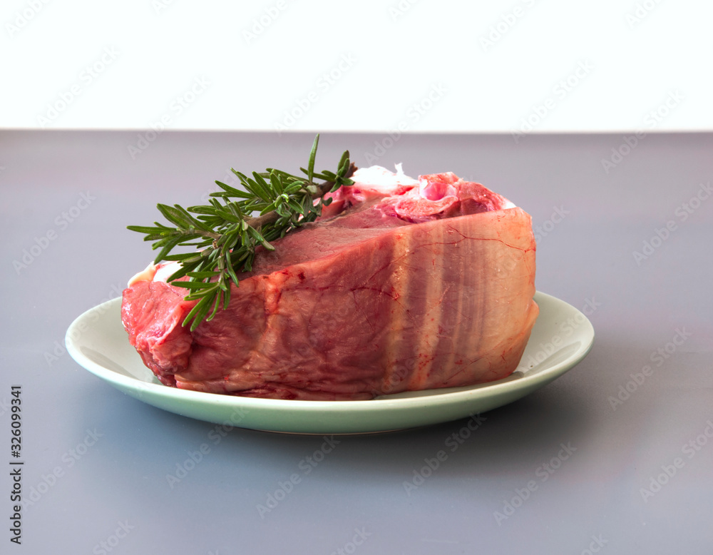 Raw beef fillet steaks with herbs and spices Raw beef fillet steaks with herbs and spices