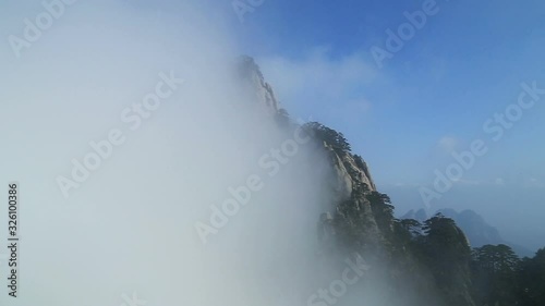 Mist, clouds rising in Huangshan national park, (Yellow Mountain) Anhui Porvince, China. photo