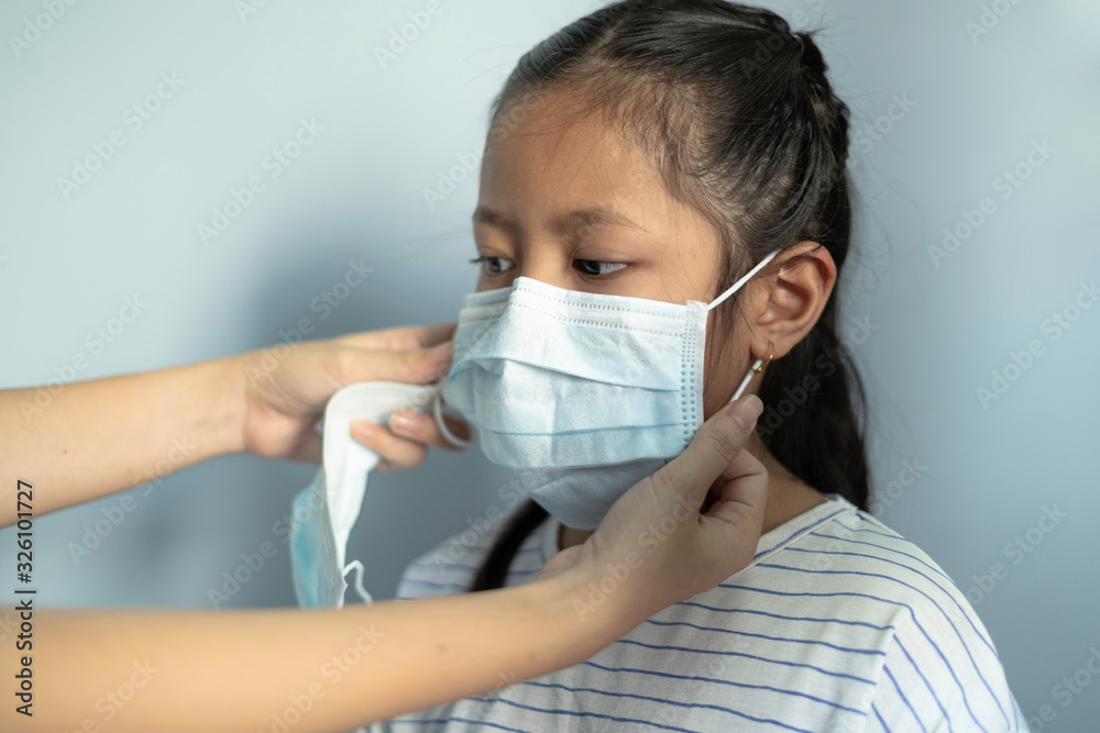 Children girl waring mask to protect Covid-19 virus and PM2.5 air pollution Children girl waring mask to protect Covid-19 virus and PM2.5 air pollution