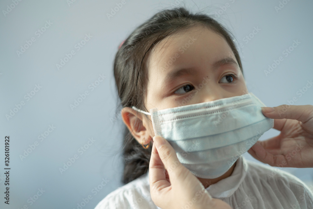 Children girl waring mask to protect Covid-19 virus and PM2.5 air pollution