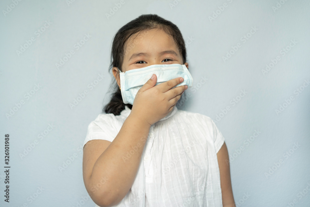Children girl waring mask to protect Covid-19 virus and PM2.5 air pollution Children girl waring mask to protect Covid-19 virus and PM2.5 air pollution