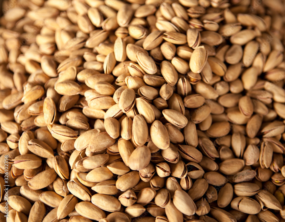 Iranian salted pistachios. Ripe pistachios at a market setting. Iranian salted pistachios. Ripe pistachios at a market setting.