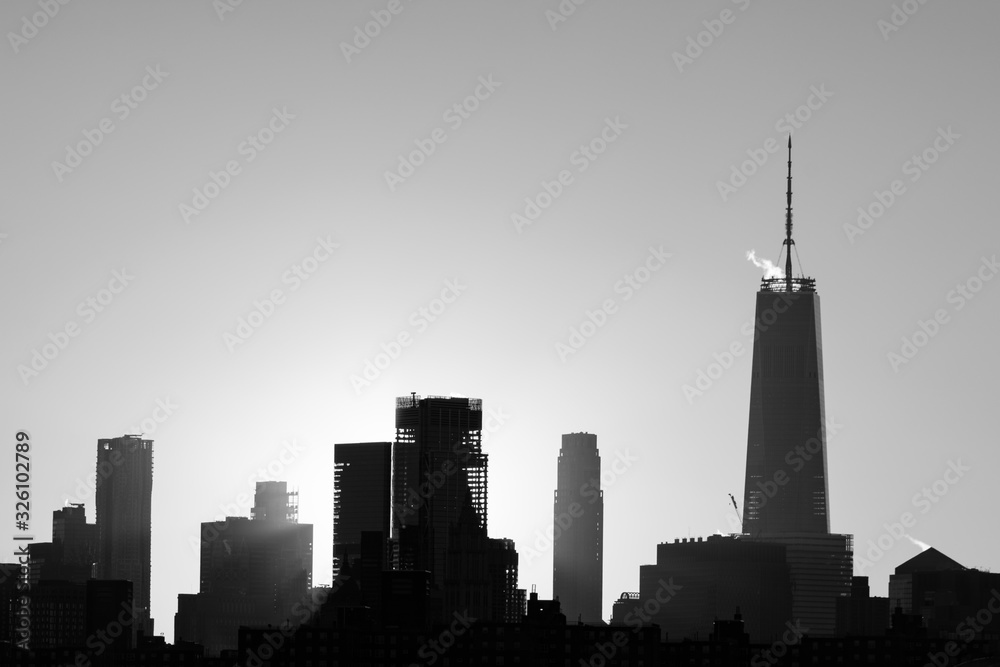 Black and White Lower Manhattan Skyline in New York City during Sunset with Silhouettes of Skyscrapers