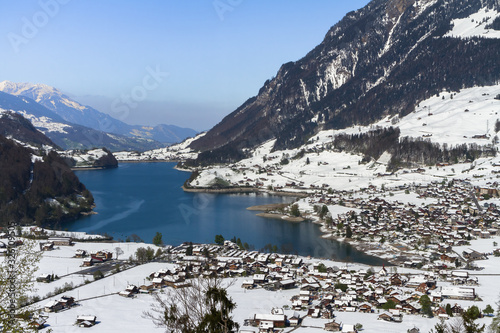 LUNGERN, SWITZERLAND - FEBRUAR 13, 2018: Panoramic winter view of the lake Lungern.