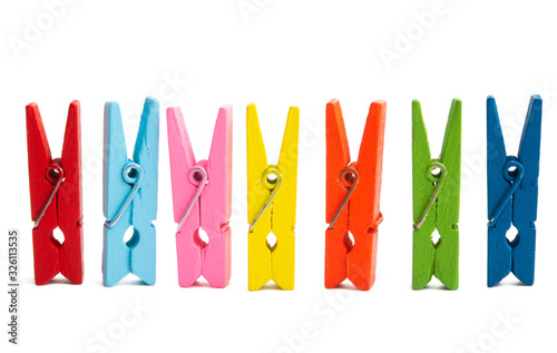 colored wooden clothespins isolated