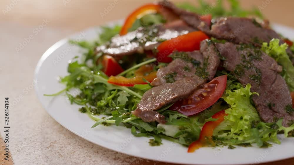 Close up salad with beef lettuce tomato cuisine meat green lunch plate meal food vegetable healthy fresh appetizer dish slow motion Close up salad with beef lettuce tomato cuisine meat green lunch plate meal food vegetable healthy fresh appetizer dish slow motion