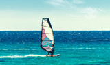 young surfer girl rides a sail in the Red Sea in Egypt Sharm el Sheikh