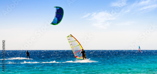 windsurfers and kitesurfers ride in the Red Sea in Egypt Sharm El Sheikh