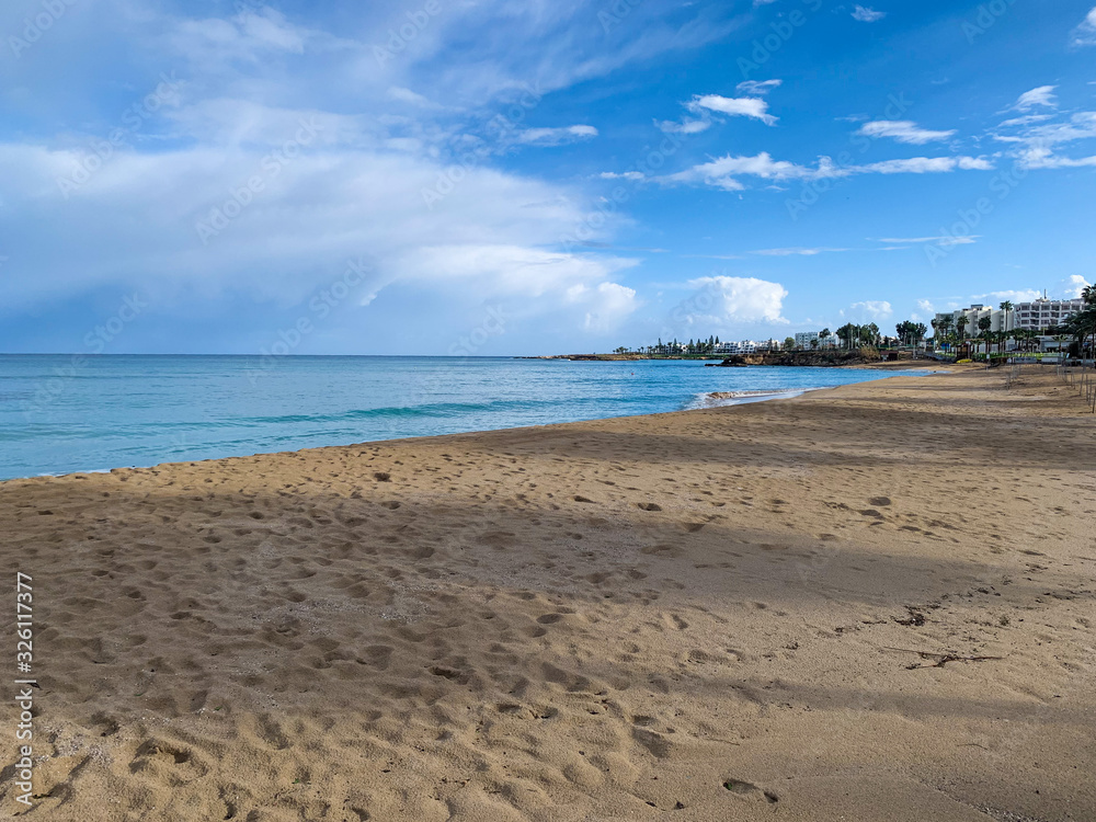 sunny landscape with ocean and clouds