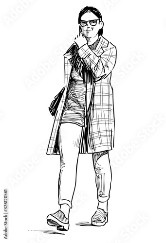 Sketch of young modern woman in eyeglasses walking along street