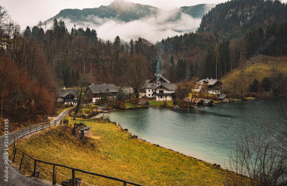 European village moody country side scenic view environment lake coast and cloudy Alps mountains landscape environment background