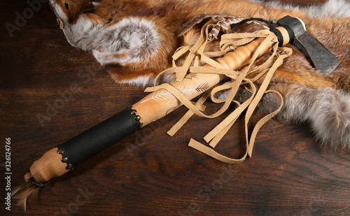 Tomahawk with Fox Coat on wooden Table - Background