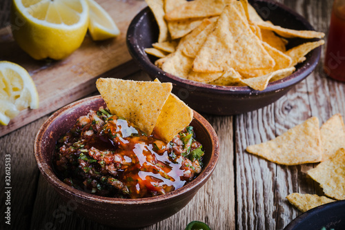 Photo Homemade salsa and tortilla chips, favorite Mexican appetizer snack