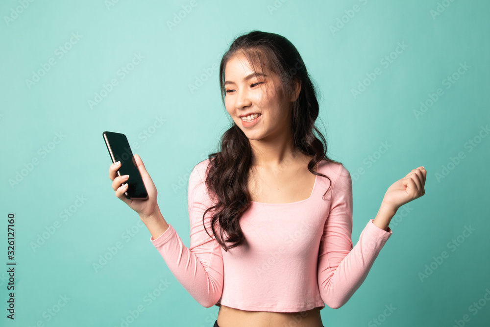 Happy Young Asian woman with mobile phone. Happy Young Asian woman with mobile phone.