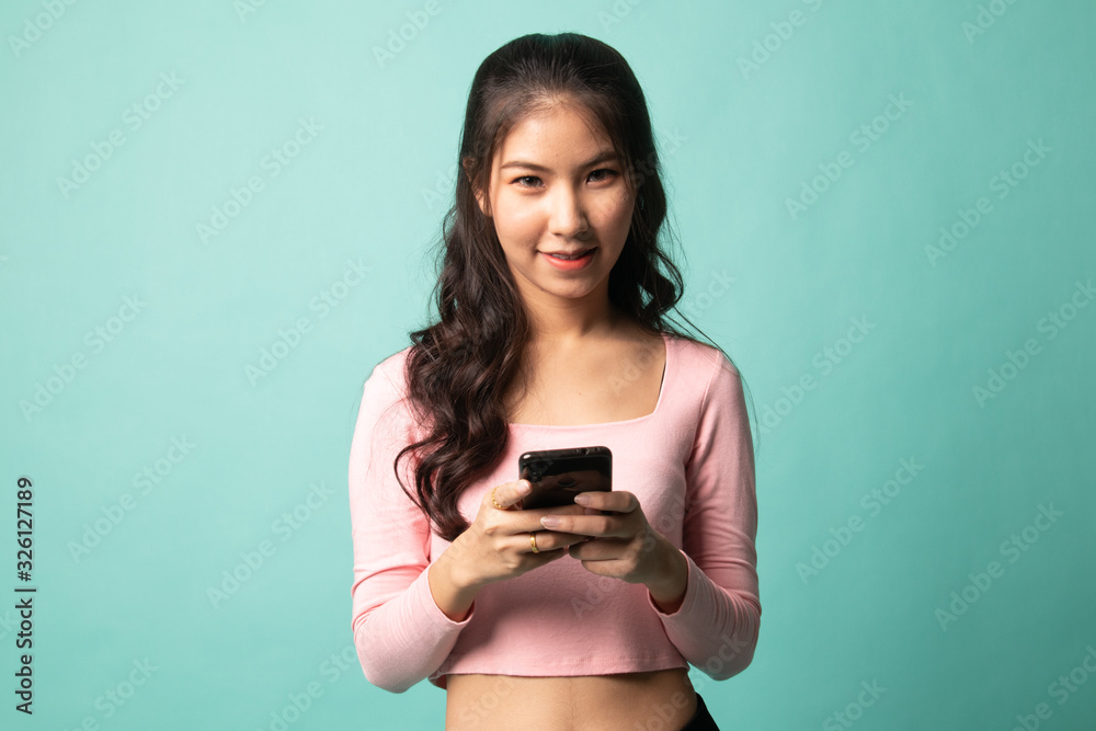 Young Asian woman with mobile phone. Young Asian woman with mobile phone.