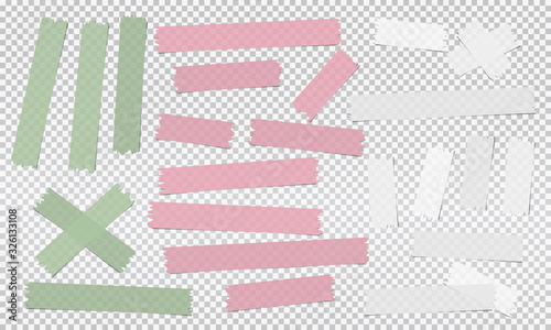 White, pink, green different size adhesive, sticky, masking, duct tape, paper pieces are on squared gray background