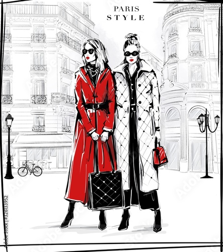Hand drawn two beautiful young women in sunglasses. Fashion women with Paris street background. Girls in fashion clothes. Sketch. Fashion illustration.