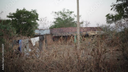 Poor village house India, long shot, soft focus, shallow DOF