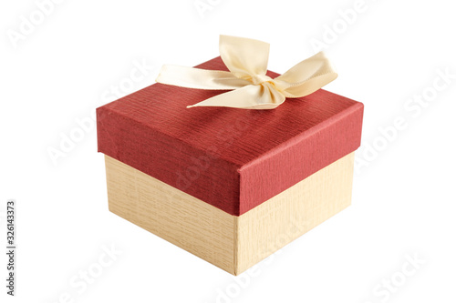 Gift box with bow isolated on white background. Selective focus. Space for text.