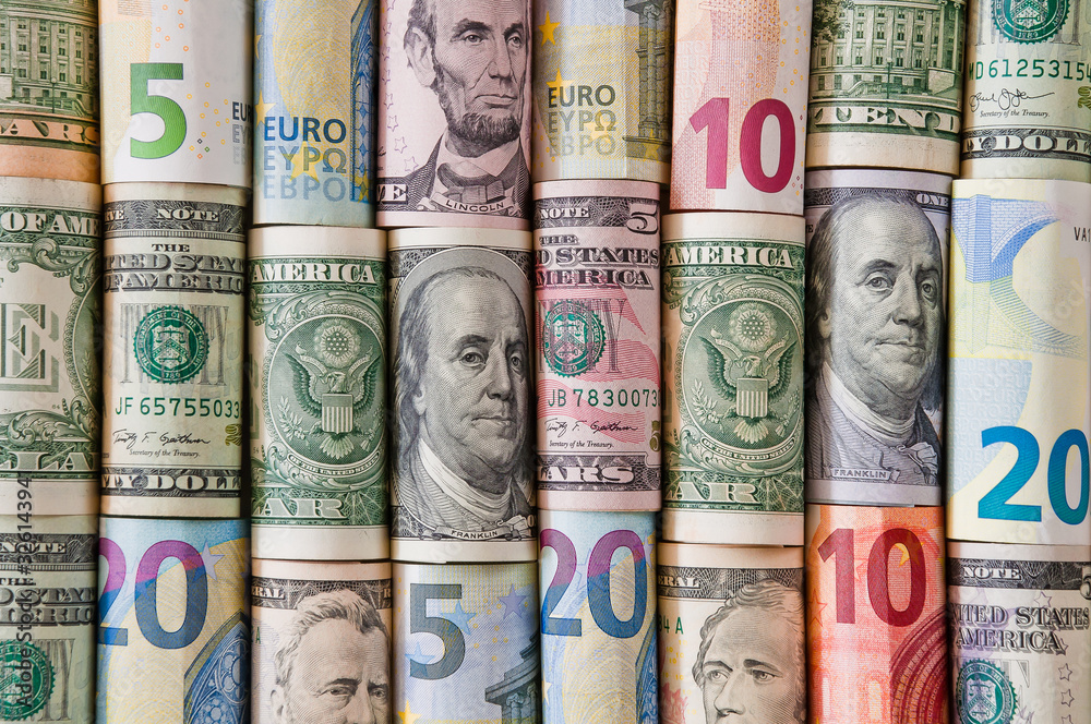 Background of twisted dollar and euro banknotes Background of twisted dollar and euro banknotes