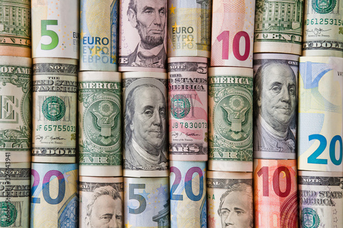 Background of twisted dollar and euro banknotes