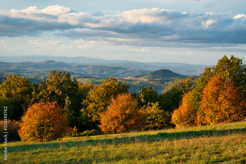 2020-02-24 THE TUSCAN VALLEY WITH FALL FOLIAGE AND CLOUDS