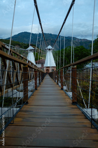 Suspended Bridge Connecting Olaya City and Santa Fe City, with Wooden Planks with a Pedestrian Part and another for Small Vehicles and Motorcycles