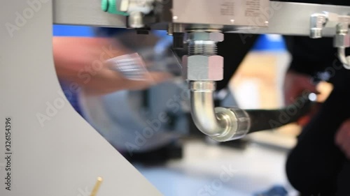  worker who assembles hydraulic components on very high pressure hydraulic system