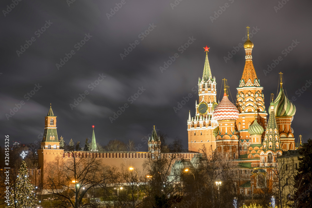 Spasskaya tower of the Kremlin and St. Basil's Cathedral in night - Moscow, Russia, 17 01 2020