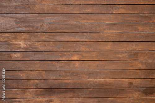 Wall of wooden boards covered with stain.
