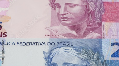 Wallpaper Mural Various Brazil real notes tracking. Brazilian money background. Slider shot. Low angle, macro. 4K Torontodigital.ca