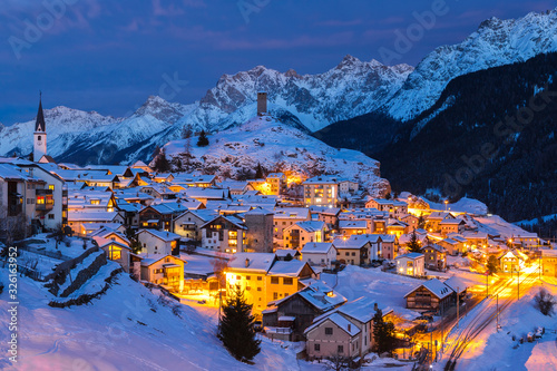 the lights of the Swiss village covered by snow, Ardez Switzerland photo