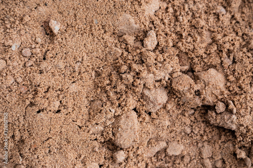 Brown ground surface. Close up natural background. Ground texture