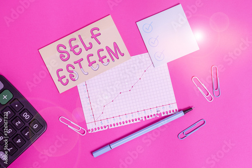 Handwriting text writing Self Esteem. Conceptual photo a feeling of having respect for yourself and your abilities Stationary and note paper plus math sheet with diagram picture on the table photo