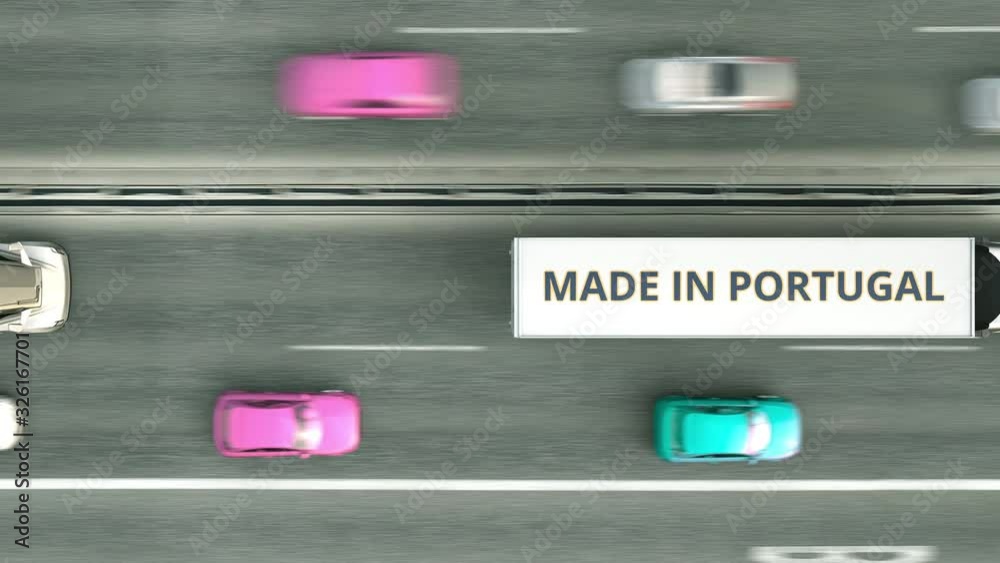 Aerial overhead view of trailer trucks with MADE IN PORTUGAL text driving along the road. Portuguese business related loopable 3D animation