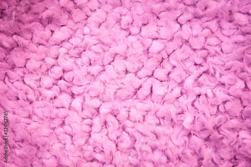 Close-up of wool, fur texture background. Fur background. pink cotton, sheepskin texture
