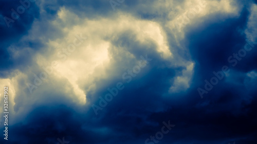 Dramatic stormy dark blue cloudy sky, natural photo background
