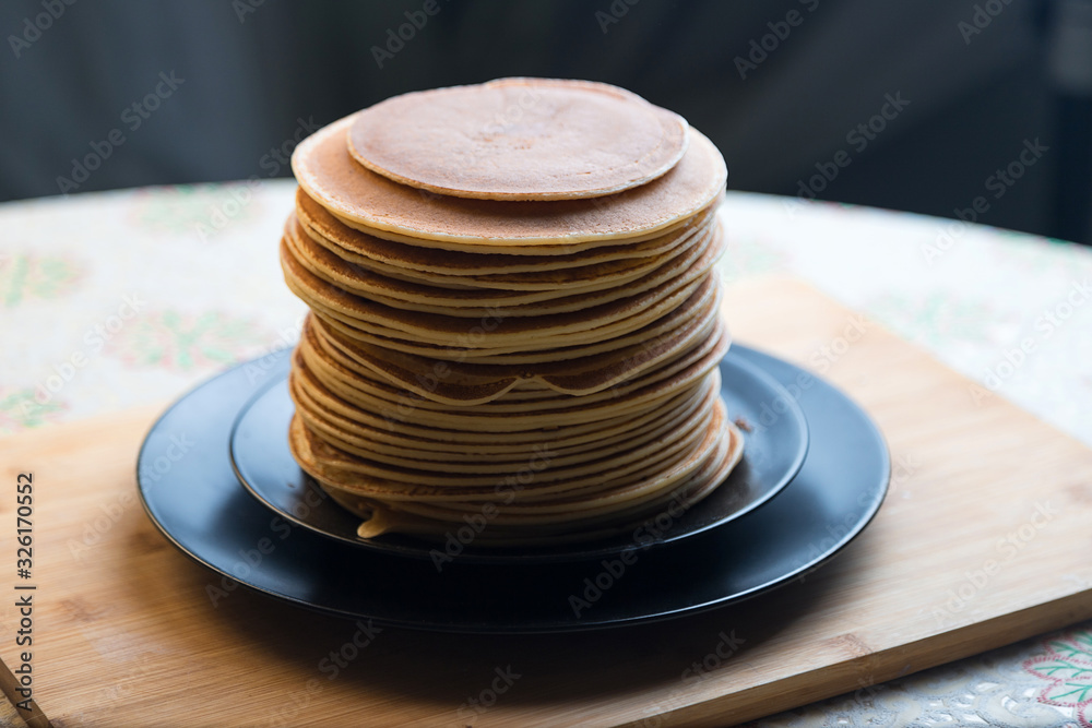 Stack of pancakes. Classic Russian dessert. The holiday of Maslenitsa. Stack of pancakes. Classic Russian dessert. The holiday of Maslenitsa.