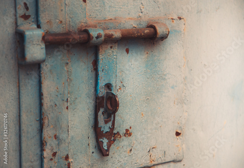 Metal door with bolt in grungy style with copy-space