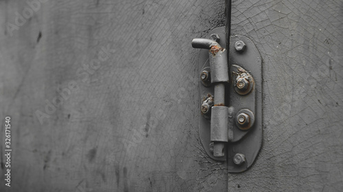 Metal door with bolt in grungy style with copy-space © lunarts_studio