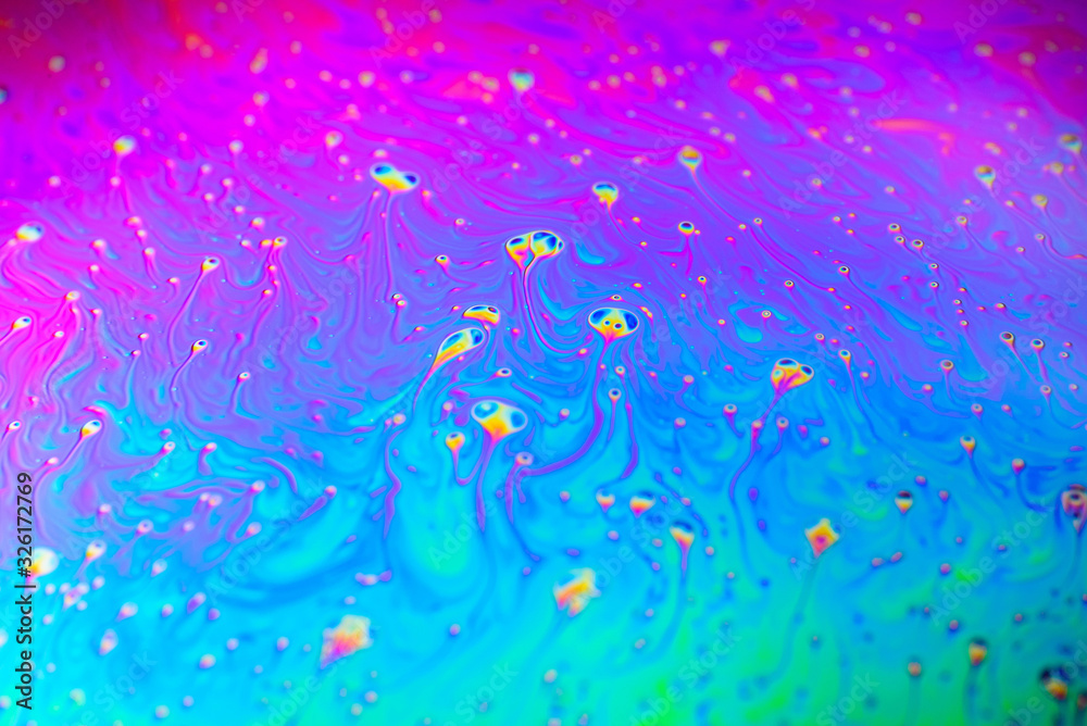 Macro photo of a rainbow soap bubble