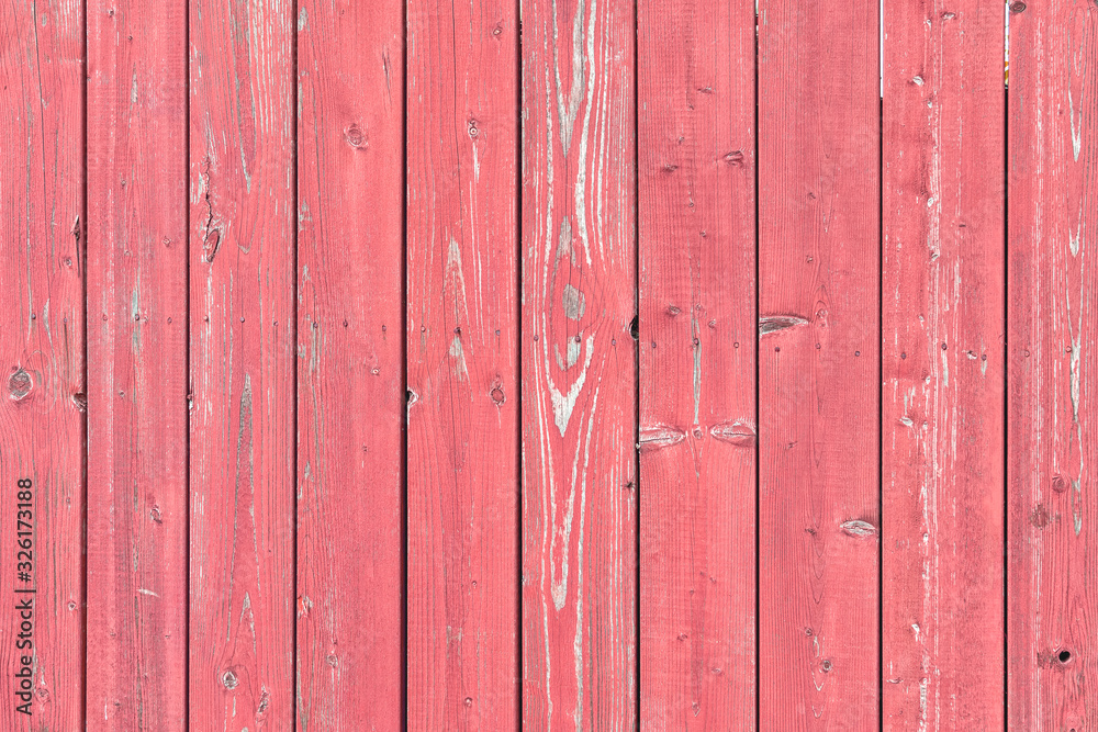 Painted wooden fence with peeling paint. Background for sites and layouts in red. Painted wooden fence with peeling paint. Background for sites and layouts in red.