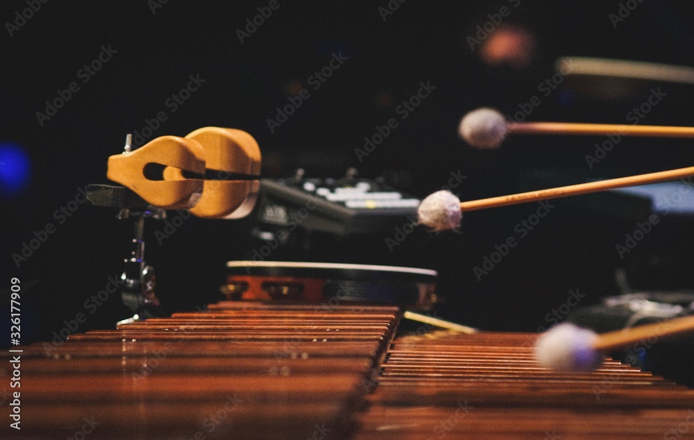 A man playing a marimba on a concert stage