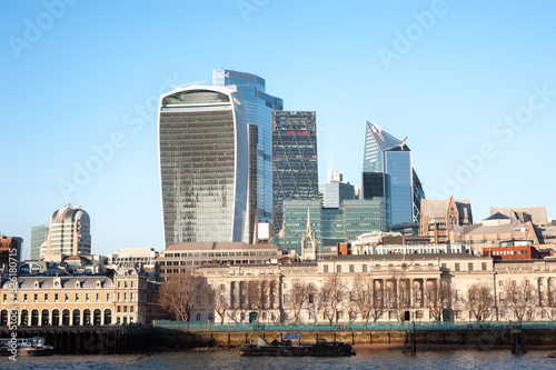 Custom House in the foreground overlooked by the skyscrapers of the City of London photo