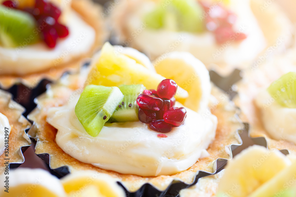 custard with kiwi and pomegranate tart. custard with kiwi and pomegranate tart.
