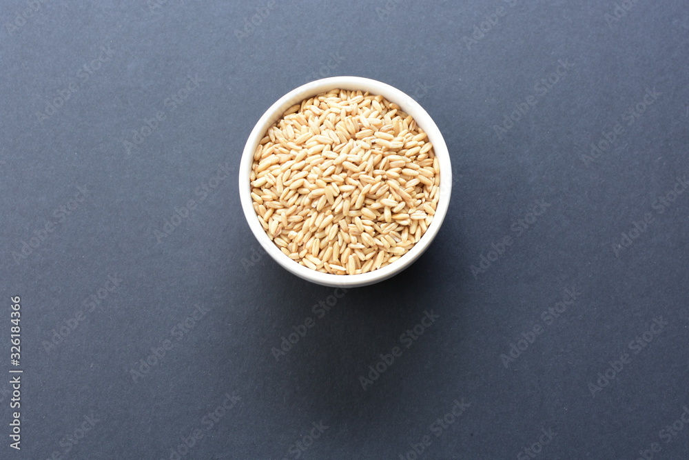 Natural oat grains, in containers for display Natural oat grains, in containers for display