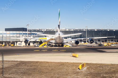 Cuadro en lienzo Big wide-body commercial passenger plane during maintenance and flight preparation at international airport