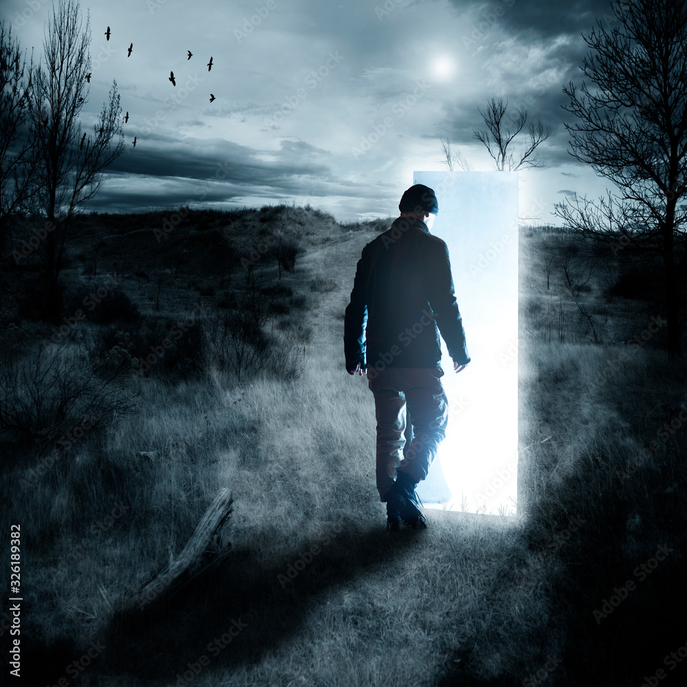 silhouette of man walking into mystic portal, conceptual image