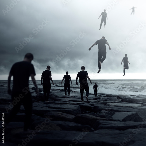 Group of people walking towards the ocean and floating away into the sky, conceptual image photo