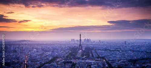 panorama of skyline of Paris with Eiffel Tower at sunset in Paris, France. Eiffel Tower is one of the most iconic landmarks of Paris. © Melinda Nagy